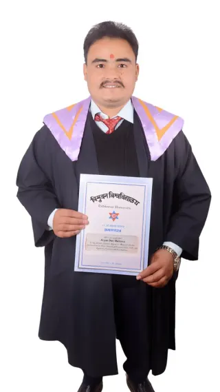Man in academic robes holding a Dipandun University